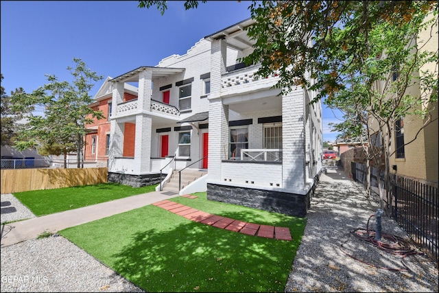 615 Arizona Ave, El Paso, TX 79902 - view of front of home featuring brick siding and a balcony