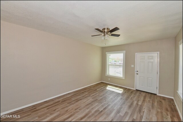 615 Arizona Ave, El Paso, TX 79902 - foyer with light wood-type flooring, ceiling fan, and baseboards
