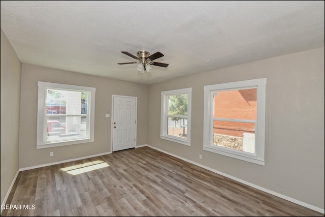 615 Arizona Ave, El Paso, TX 79902 - entryway with wood finished floors, a ceiling fan, and baseboards