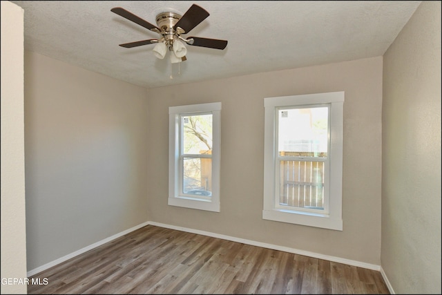 615 Arizona Ave, El Paso, TX 79902 - empty room with wood finished floors, baseboards, and a ceiling fan