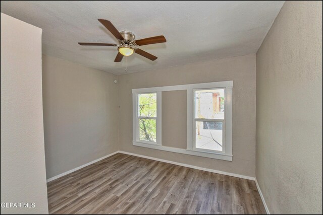 615 Arizona Ave, El Paso, TX 79902 - spare room featuring wood finished floors, baseboards, and ceiling fan