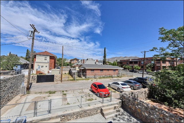 615 Arizona Ave, El Paso, TX 79902 - view of asphalt road with a gate and a residential view