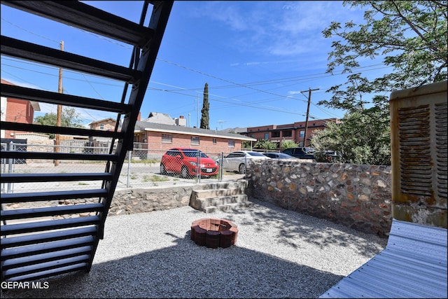 615 Arizona Ave, El Paso, TX 79902 - view of patio / terrace featuring an outdoor fire pit and a residential view