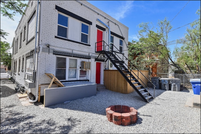 615 Arizona Ave, El Paso, TX 79902 - view of front of property featuring brick siding, an outdoor fire pit, and stairway