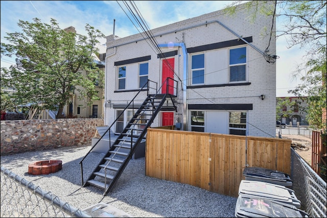 615 Arizona Ave, El Paso, TX 79902 - view of front of property with a fire pit, brick siding, and stairs