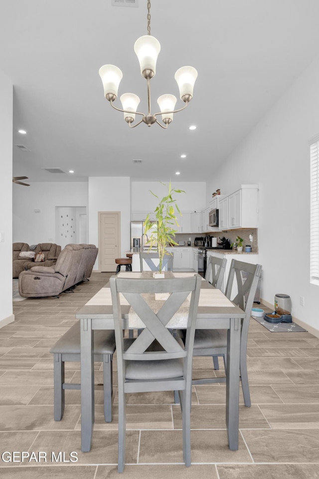 12614 Amesbury, El Paso, TX 79928 - dining space featuring wood tiled floors, a chandelier, baseboards, and recessed lighting
