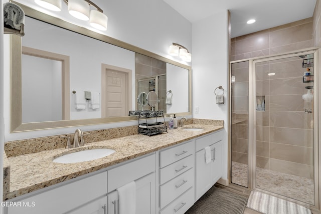 12614 Amesbury, El Paso, TX 79928 - bathroom with a stall shower and double vanity