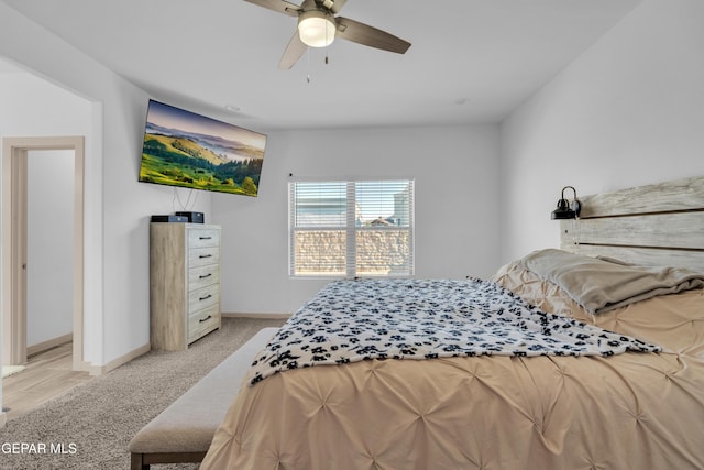 12614 Amesbury, El Paso, TX 79928 - bedroom featuring light carpet, baseboards, and a ceiling fan