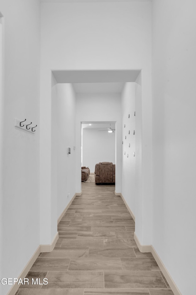 12614 Amesbury, El Paso, TX 79928 - corridor featuring wood finished floors and baseboards