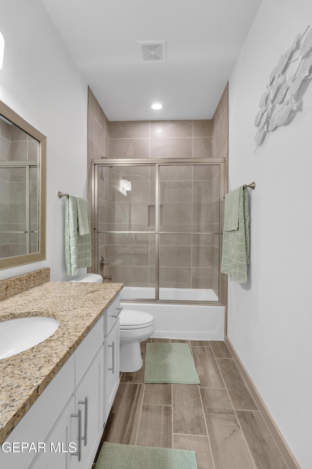 12614 Amesbury, El Paso, TX 79928 - full bath with vanity, toilet, and shower / bath combination with glass door
