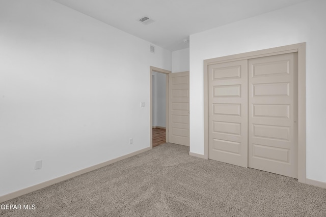 12614 Amesbury, El Paso, TX 79928 - unfurnished bedroom with carpet flooring, a closet, and baseboards