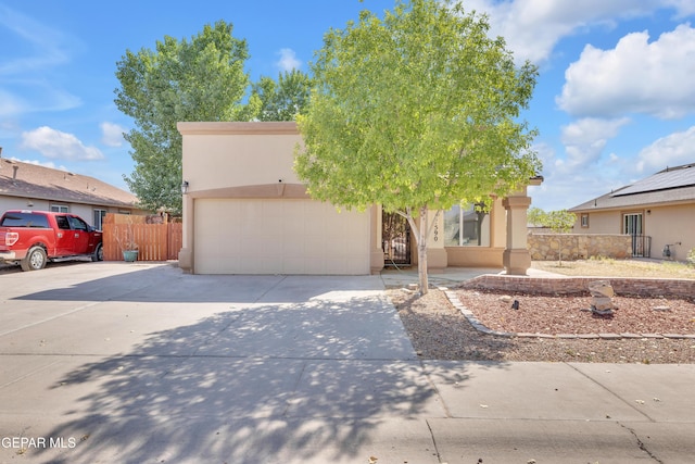 11590 Flor Liatris Dr, Socorro, TX 79927 - view of front of home featuring concrete driveway, stucco siding, and a garage