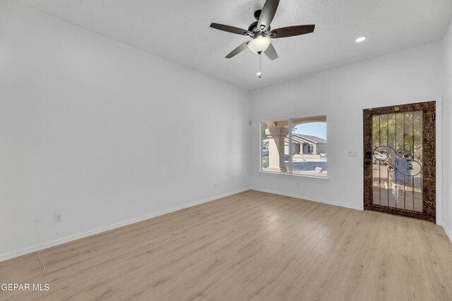 11590 Flor Liatris Dr, Socorro, TX 79927 - spare room with light wood-style floors, a ceiling fan, baseboards, and recessed lighting