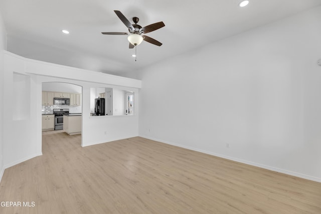 11590 Flor Liatris Dr, Socorro, TX 79927 - unfurnished living room with light wood-style floors, ceiling fan, recessed lighting, and baseboards