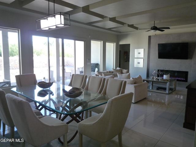 5868 Valley Palm Dr, El Paso, TX 79932 - dining space featuring coffered ceiling, tile patterned floors, beamed ceiling, a large fireplace, and a ceiling fan
