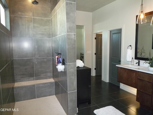 5868 Valley Palm Dr, El Paso, TX 79932 - bathroom with vanity, tiled shower, and tile patterned floors