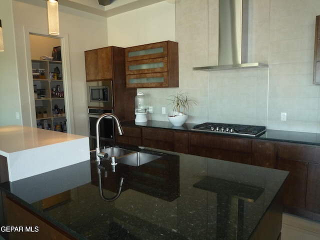 5868 Valley Palm Dr, El Paso, TX 79932 - kitchen featuring wall chimney range hood, a sink, appliances with stainless steel finishes, decorative backsplash, and dark stone countertops