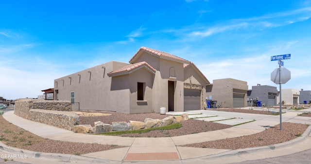 1741 Breeder Cup Way, El Paso, TX 79928 - view of building exterior featuring an attached garage and concrete driveway