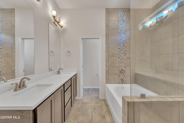 1741 Breeder Cup Way, El Paso, TX 79928 - full bathroom with a bathtub, double vanity, and baseboards