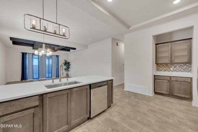 1741 Breeder Cup Way, El Paso, TX 79928 - kitchen featuring dishwasher, backsplash, a sink, a chandelier, and light countertops