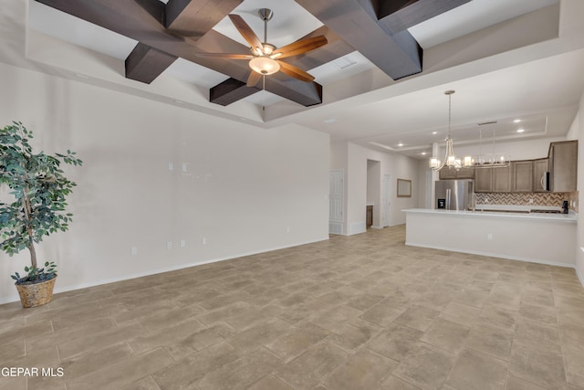 1741 Breeder Cup Way, El Paso, TX 79928 - unfurnished living room featuring coffered ceiling, recessed lighting, a raised ceiling, ceiling fan, and a chandelier