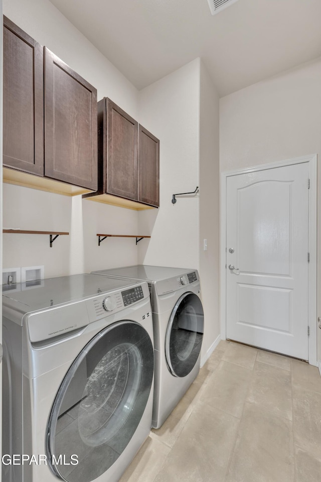 1741 Breeder Cup Way, El Paso, TX 79928 - laundry area with cabinet space, washer and dryer, light tile patterned flooring, and baseboards