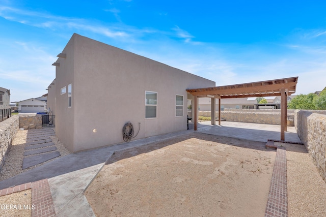1741 Breeder Cup Way, El Paso, TX 79928 - view of side of property with a patio and stucco siding