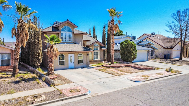 11513 Cree Ct, El Paso, TX 79936 - traditional-style home with concrete driveway, stucco siding, and roof with shingles