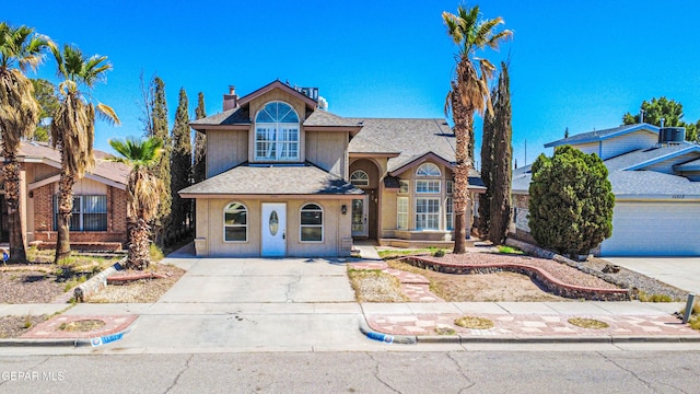 11513 Cree Ct, El Paso, TX 79936 - traditional home featuring stucco siding, a shingled roof, central AC unit, and concrete driveway