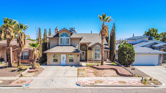 11513 Cree Ct, El Paso, TX 79936 - traditional-style home featuring driveway, roof with shingles, stucco siding, and a chimney
