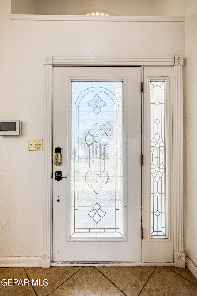 11513 Cree Ct, El Paso, TX 79936 - tiled entrance foyer with baseboards and healthy amount of natural light