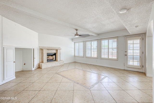11513 Cree Ct, El Paso, TX 79936 - unfurnished living room with light tile patterned floors, a textured ceiling, a ceiling fan, baseboards, and a high end fireplace