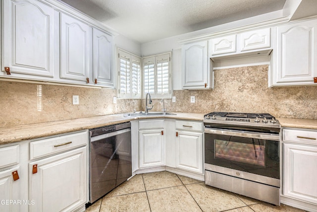 11513 Cree Ct, El Paso, TX 79936 - kitchen with dishwasher, stainless steel gas stove, a sink, light tile patterned floors, and tasteful backsplash