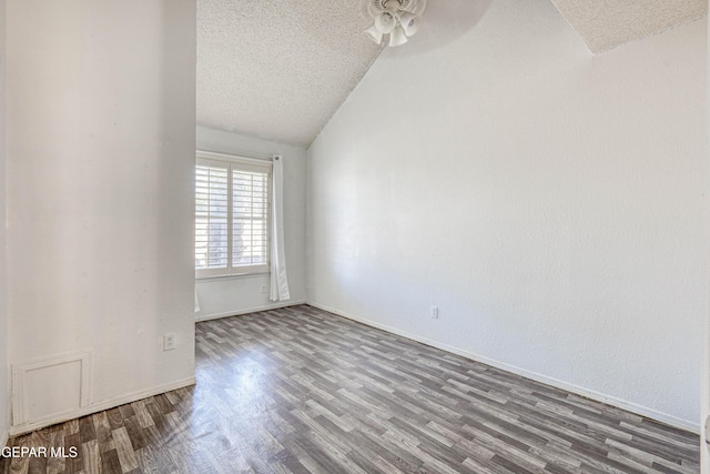 11513 Cree Ct, El Paso, TX 79936 - spare room featuring a textured ceiling, wood finished floors, lofted ceiling, ceiling fan, and baseboards