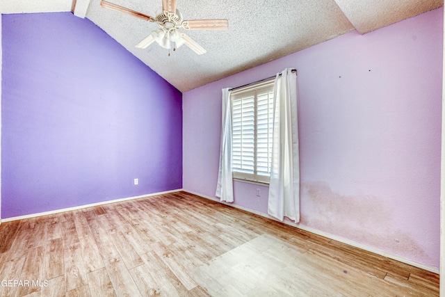 11513 Cree Ct, El Paso, TX 79936 - empty room featuring vaulted ceiling, wood finished floors, ceiling fan, and a textured ceiling