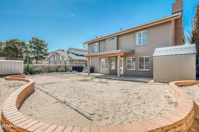 11513 Cree Ct, El Paso, TX 79936 - back of house featuring a patio, a chimney, a fenced backyard, and brick siding