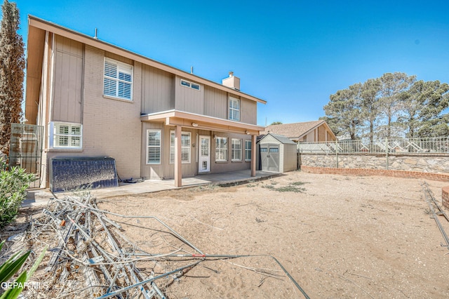 11513 Cree Ct, El Paso, TX 79936 - rear view of house with a chimney, a patio, a fenced backyard, and brick siding