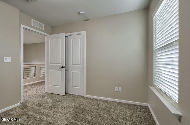 3804 Surmise St, El Paso, TX 79928 - unfurnished bedroom featuring carpet floors, multiple windows, and baseboards