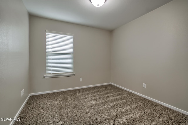 3804 Surmise St, El Paso, TX 79928 - empty room featuring dark colored carpet and baseboards