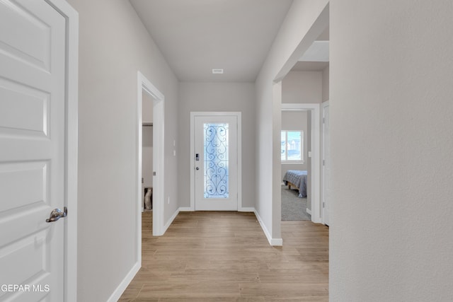 13676 Lago Vista Ave, Horizon City, TX 79928 - foyer featuring baseboards and light wood-style flooring