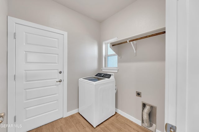 13676 Lago Vista Ave, Horizon City, TX 79928 - laundry room with washer / clothes dryer, light wood finished floors, and baseboards