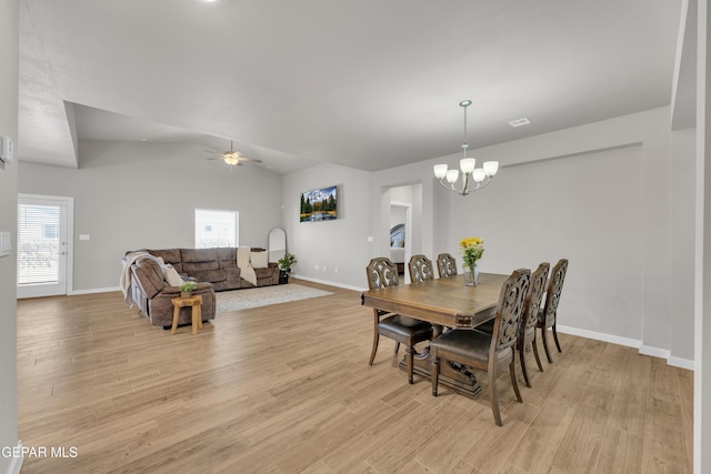 13676 Lago Vista Ave, Horizon City, TX 79928 - dining room featuring baseboards, a chandelier, light wood-style flooring, lofted ceiling, and ceiling fan