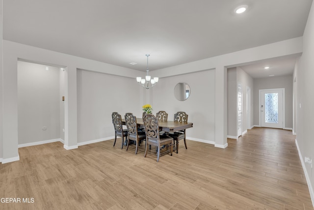 13676 Lago Vista Ave, Horizon City, TX 79928 - dining space with light wood-style floors, baseboards, and a chandelier