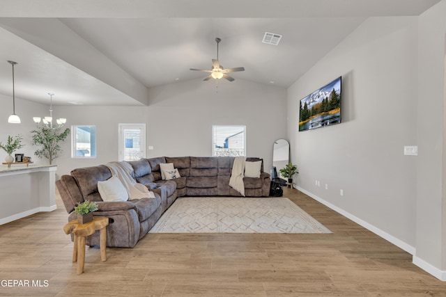13676 Lago Vista Ave, Horizon City, TX 79928 - living area with a ceiling fan, light wood-type flooring, a chandelier, baseboards, and lofted ceiling