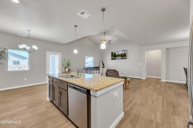 13676 Lago Vista Ave, Horizon City, TX 79928 - kitchen featuring stainless steel dishwasher, a sink, baseboards, vaulted ceiling, and light wood-style flooring