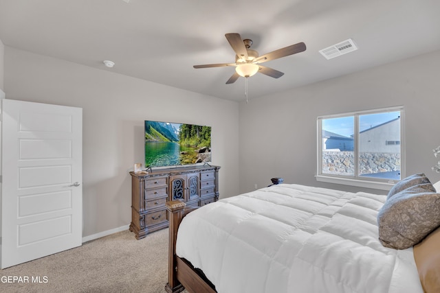 13676 Lago Vista Ave, Horizon City, TX 79928 - bedroom featuring light colored carpet, ceiling fan, and baseboards