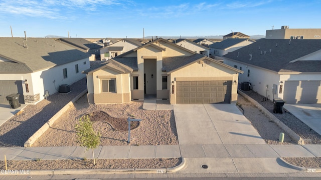 13676 Lago Vista Ave, Horizon City, TX 79928 - view of front facade featuring a residential view, a garage, central AC, stucco siding, and driveway