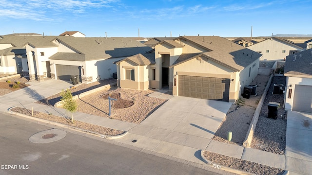 13676 Lago Vista Ave, Horizon City, TX 79928 - ranch-style house featuring concrete driveway, a residential view, stucco siding, and an attached garage