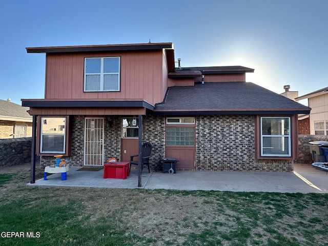 11048 Nathan Bay Dr, El Paso, TX 79934 - back of property with a patio area, brick siding, and a yard