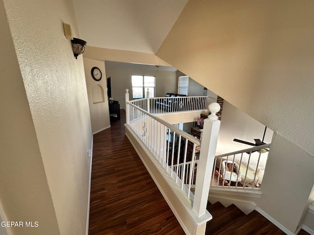 11048 Nathan Bay Dr, El Paso, TX 79934 - stairs featuring wood finished floors, baseboards, and a textured wall